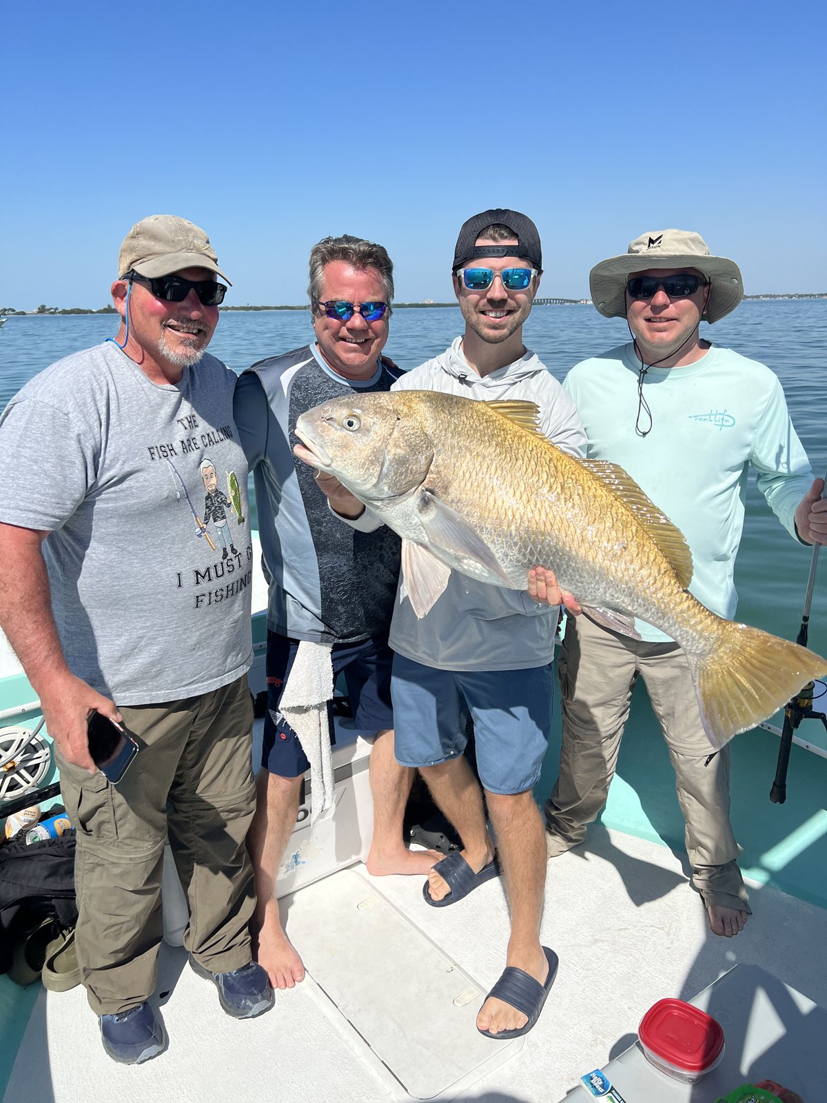 A group of guests with their catch on an inshore charter