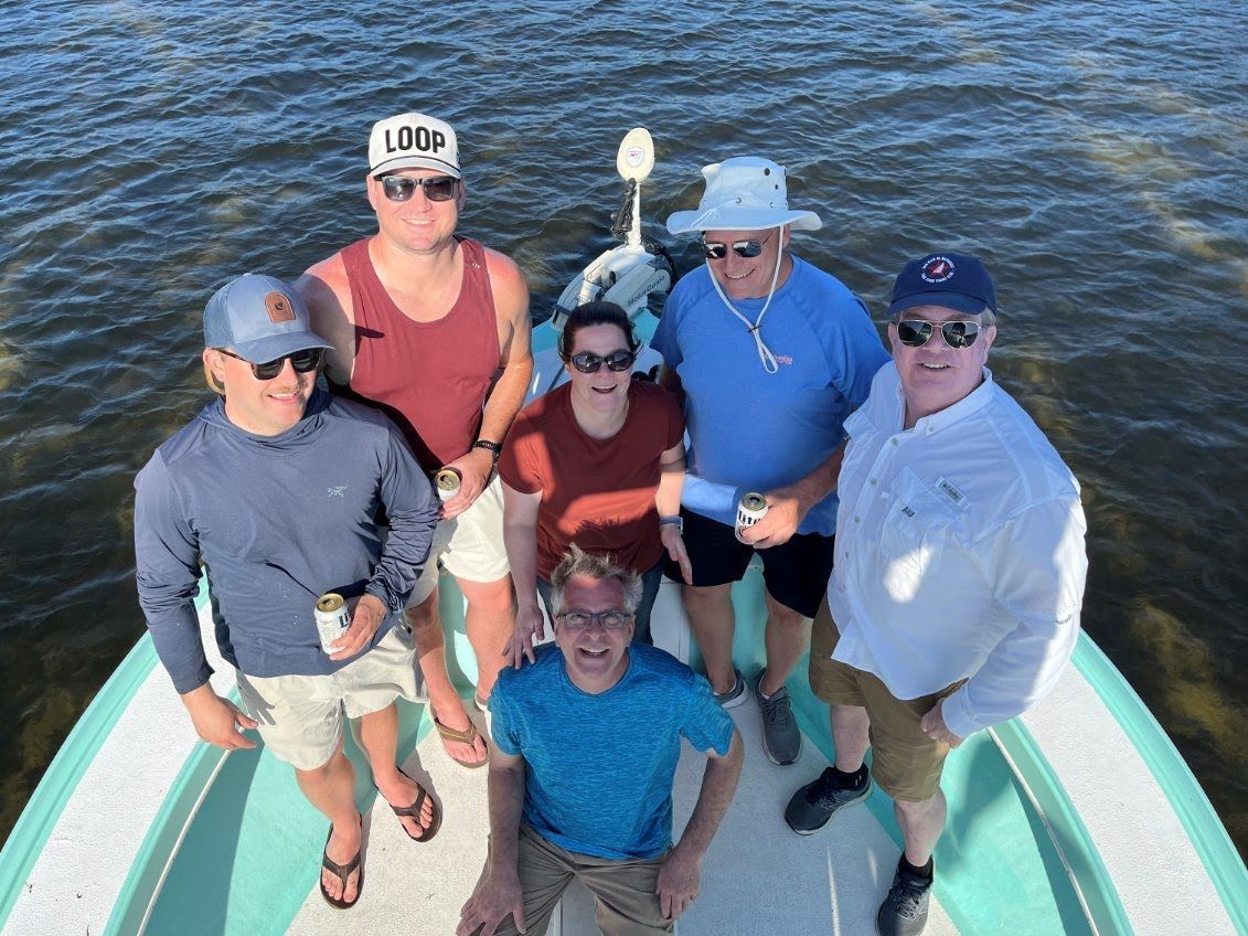 Group of guests on the bow of the boat during a Pasco County scallop charter